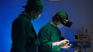 Doctors in VR glasses performing surgery in hospital.